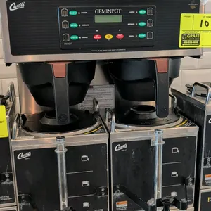 Curtis GEMGT-T Gemini GT twin head commercial coffee brewer. Features digital control panel and central hot water faucet. Includes (2) Curtis GEM-3 sa