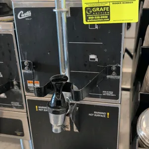 Curtis GEM-3 satellite coffee dispenser with warming stand. Features front dispensing faucet with metal guard, sight glass level gauge, top carrying h