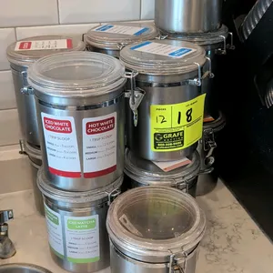 Hubert stainless steel product containers. Features clear plastic clamp lids with latch closures. 6"H each.