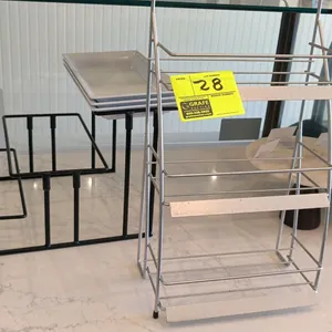 Assorted bakery and beverage countertop display fixtures. Includes a 3-tier wire display rack with channel strips, a 3-tier black metal riser with rec