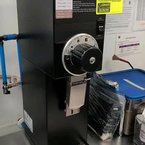 Bunn Coffee Mill commercial coffee grinder. Features multi-position adjustable grind selector dial from coarse to Turkish, dispensing chute with clean
