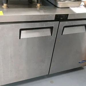 2022 Atosa MGF8406GR 2-door undercounter freezer. Features stainless steel construction, recessed door handles, and interior wire shelving. S/N: MGF84