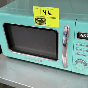 Galanz countertop microwave oven. Features retro-style design in mint green finish, chrome pull handle, digital display, push-button controls with rot