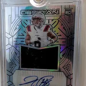 A Javon Baker Rookie Autograph Memorabilia Card. (Panini, 2024) A 2024 Panini Obsidian Football rookie jersey autograph card of New England Patriots r