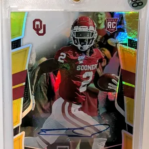 A CeeDee Lamb Signed Rookie Trading Card. (Panini, 2020) A 2020 Panini Chronicles Draft Picks Certified No. 2 rookie card depicting CeeDee Lamb with t