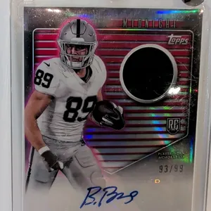 A Brock Bowers Rookie Jersey Autograph Card. (Topps, 2024) A 2024 Topps Midnight Football card #RJA-BB featuring Las Vegas Raiders tight end Brock Bow