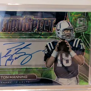 A Peyton Manning Signed 2021 Panini Spectra "Retrospect" Prizm Card. (Panini, 2021) Featuring a blue ink autograph of the Hall of Fame quarterback in 