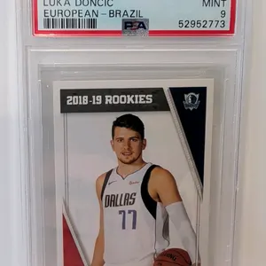 A 2018 Panini Stickers #428 Luka Doncic Rookie Sticker. (Panini, 2018) A European - Brazil edition rookie sticker featuring Luka Doncic with the Dalla