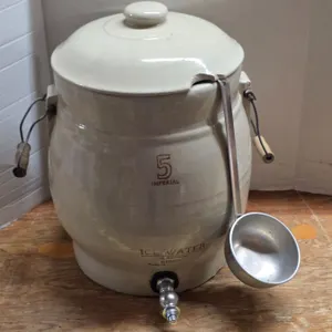 #5 medalta water crock- has lid and spicket- has damage