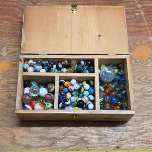 Box full of various marbles