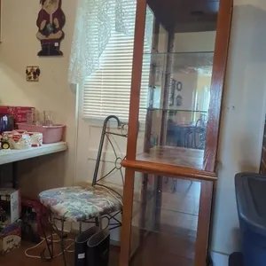 Lighted curio cabinet/ top side door is broken