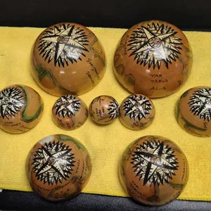 9 Hand-Painted Wooden Globe Halves with Nautical and World Map Motifs, Compass Rose Designs, Labeled