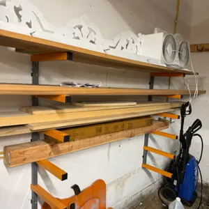 Wall-Mounted Lumber Storage Racks & Assorted Lumber