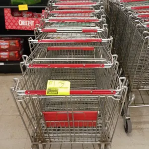 Metal wire shopping carts. Features red plastic handle trim, folding child seat, and lower wire storage tray. Mounted on casters.
