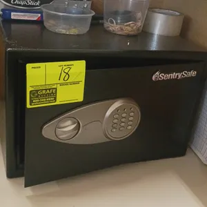 SentrySafe security safe. Features digital keypad lock and carpeted interior base. Dimensions: 17" x 14" x 11". Contents not included.