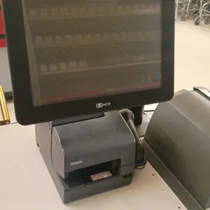 NCR point of sale system. Includes NCR touchscreen terminal, Epson receipt printer, Datalogic Magellan 8500XT in-counter scanner scale, Acer secondary