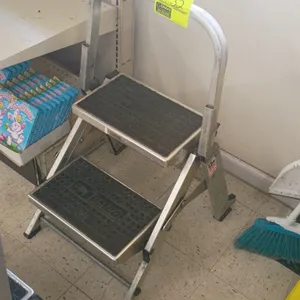 Little Jumbo 2-step folding step ladder. Features lightweight aluminum construction, slip-resistant textured step treads, folding frame, and integrate