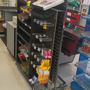 Check lane candy and merchandise display rack. Features wire shelving, pegboard panel with display hooks, and top angled shelf. 40"W x 22"D x 58"H. Mo