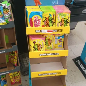 Sour Patch Kids 4-tier cardboard retail floor display. Features Swedish Fish and Sour Patch Kids graphics with upper header marquee sign. Includes 4 s