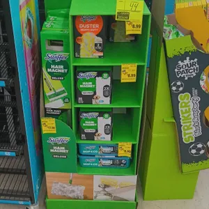 Swiffer retail cardboard floor display with assorted cleaning products. Includes Swiffer Hair Magnet Deluxe sweeping kits, Heavy Duty Duster refills, 
