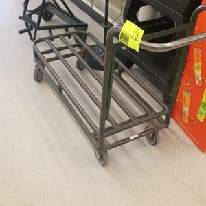 Stock cart. Features tubular steel construction and an integrated push handle. 41"L x 18"W. Mounted on casters.