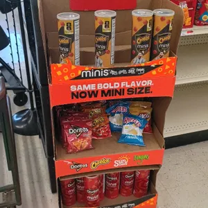 Frito-Lay Minis 3-tier corrugated cardboard snack display rack. Features Lionel Messi FIFA promotional graphic header, three open merchandising tiers,