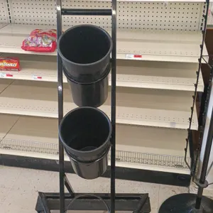 Metal clip merchandise display rack and floral display stand. Includes (1) rotating hanging clip strip spinner display on a round pedestal base and (1