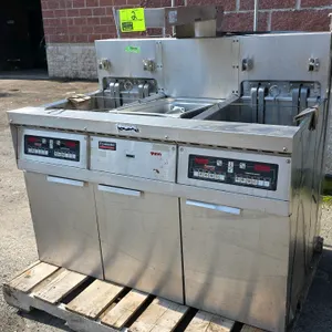 Frymaster FH22BLCSC electric deep fryer system. Stainless steel construction. Features dual fry vats with Computer Magic digital controls and central 