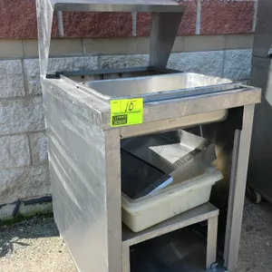 Stainless steel portable breading station. Features stainless steel construction, overhead shelf hood, drop-in well with stainless steel pan, and lowe