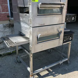 Lincoln 1116 Impinger double-stack gas conveyor oven. Features stainless steel construction, glass access doors, 19" x 4.5" openings, and wire mesh co
