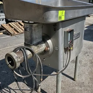 Hobart 4146 meat grinder. Features stainless steel feed pan, safety guard, spanner wrench, and tubular support legs. S/N: 11-319-838. Electrical: 200V