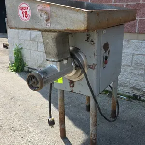 Hobart 4146 commercial meat grinder. Features top feed pan, safety guard, internal auger, push-button controls, and (2) spanner wrenches. S/N: 11-094-