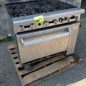 Imperial 6-burner gas range. Features stainless steel exterior, 6 open burners with cast iron grates, back riser, and lower oven base with interior ra