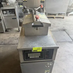 2010 BKI LGF-FC commercial natural gas pressure fryer. Features digital touchpad controls, pressure lid locking mechanism, built-in oil filtration sys