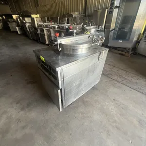 1993 BKI FKM electric pressure fryer. Features stainless steel construction, round fry pot with wire basket, locking lid with pressure gauge, and anal