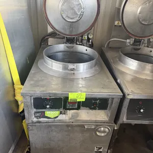 2002 BKI FKM-F electric pressure fryer. Features stainless steel construction, locking hinged lid, and digital control panel. S/N: 113825. Electrical: