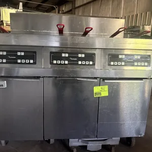 Dean SCFD350GNCS 3-compartment gas fryer. Features built-in filtration system, digital control panels, and (5) fry baskets with red handles. S/N: 1510