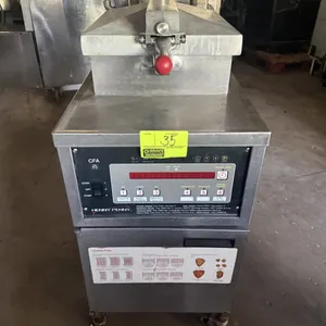 Henny Penny PFE500.2 electric pressure fryer. Features digital programmable controls, locking lid mechanism, built-in filtration system, and wire fry 