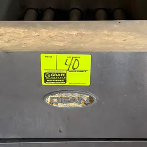 Dean gas deep fryer. Features stainless steel construction, single vat with burner tubes, rear splash guard, and lower cabinet door. Gas-powered. Moun