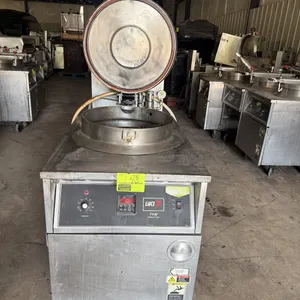 2011 BKI FKM-F commercial pressure fryer. Stainless steel construction. Features digital controls, analog thermostat dial, pressure lid assembly with 