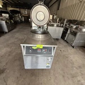 2011 BKI FKM-F commercial pressure fryer. Features stainless steel construction, digital controls, and a hinged locking pressure lid. S/N: 191100P-000