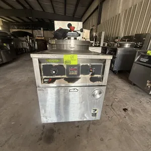 2002 BKI FKM-F commercial electric pressure fryer. Features stainless steel construction, round fry pot with locking lid, built-in filtration controls