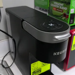Keurig single-serve coffee maker. Features push-button controls for 8 oz, 10 oz, and 12 oz brew sizes, removable drip tray, and multi-stream brew tech