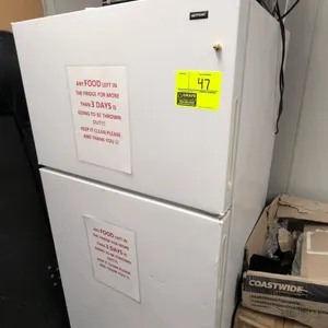 Hotpoint HTR16BBSARWW top-freezer refrigerator. Features a top freezer compartment, wire shelving, dual bottom crisper drawers, and integrated door st