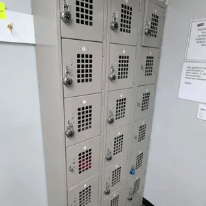 Metal 6-compartment locker units. Features 6 tiers per unit with perforated ventilated doors and padlock hasps. Dimensions: 1' x 1' x 6.5' each. Note: