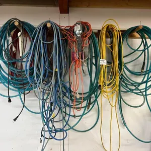 Assorted Air Hoses and Extension Cords
 UNRESERVED