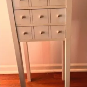 White Accent Table with 9 Drawers