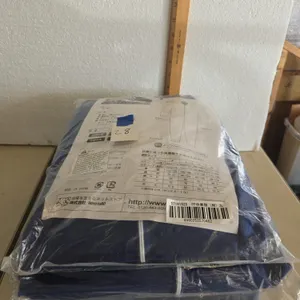 Tyvek style protective coveralls, new in packages