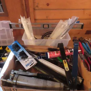 Lot - Box of Zip Ties, Level, Assorted Tools *Located at Spruce Grove location.