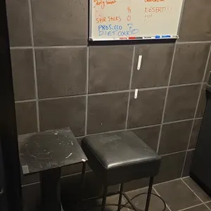 Wood table, cushioned stool and 24" dry erase board
